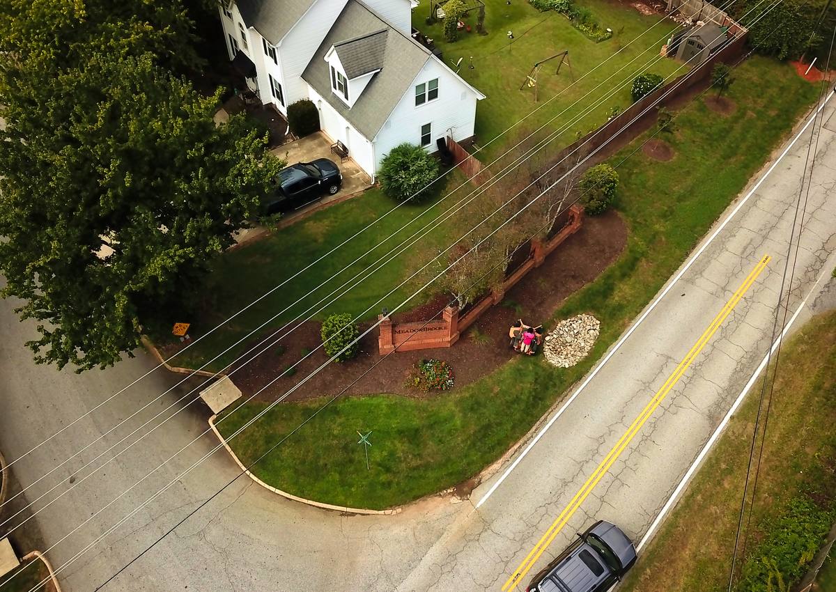 A subdivision entrance and its turf, seen from above.